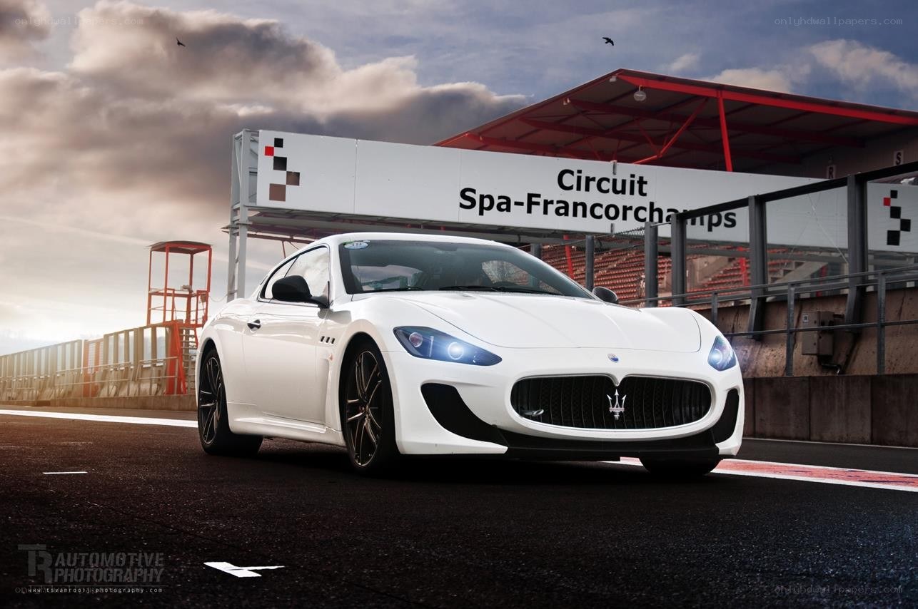 White Maserati on racetrack
