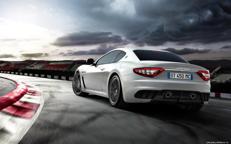 White Maserati on racetrack