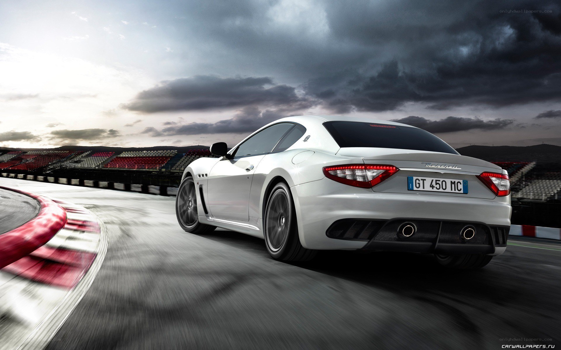 White Maserati on racetrack