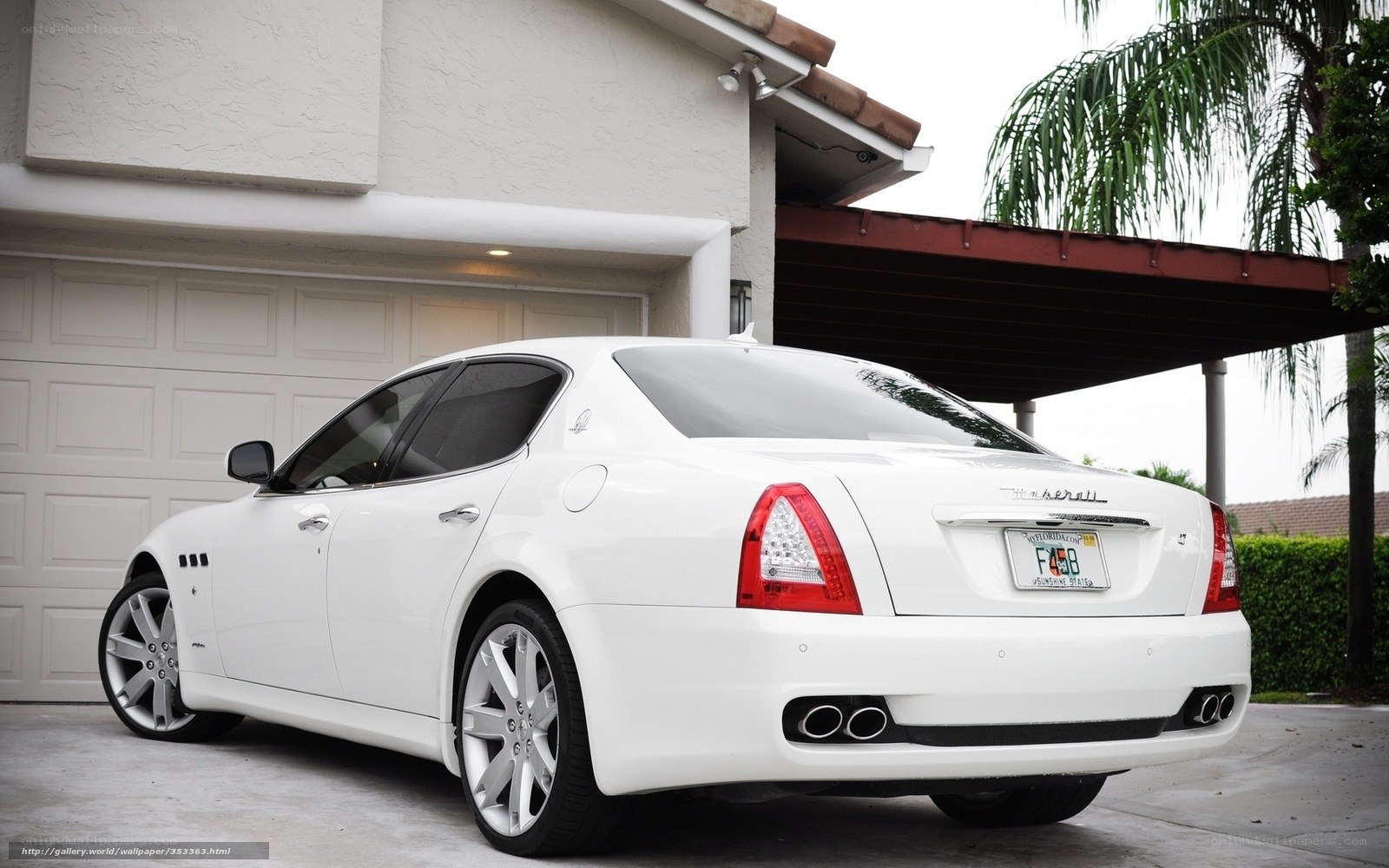White Maserati parked in driveway