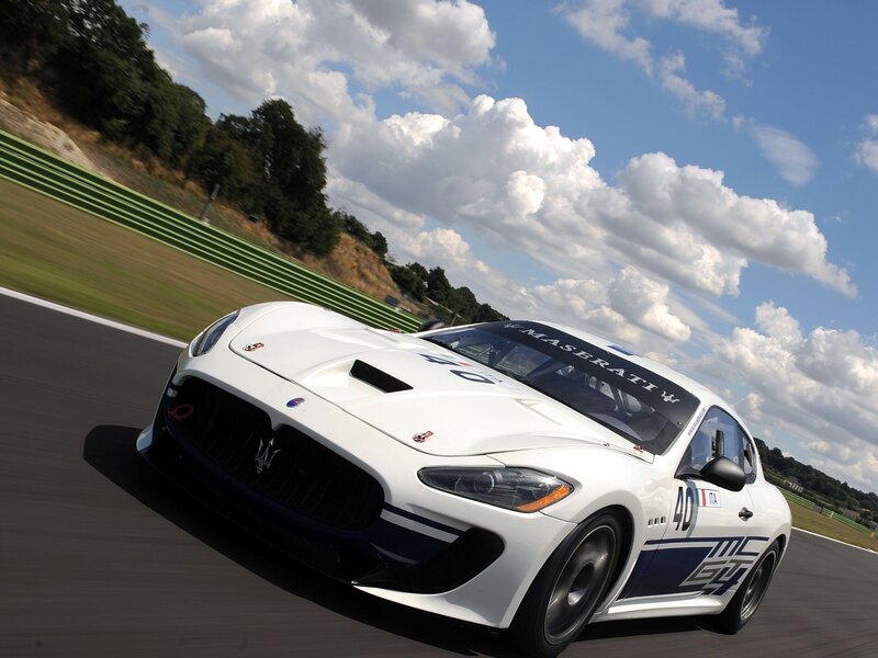 White Maserati race car on track