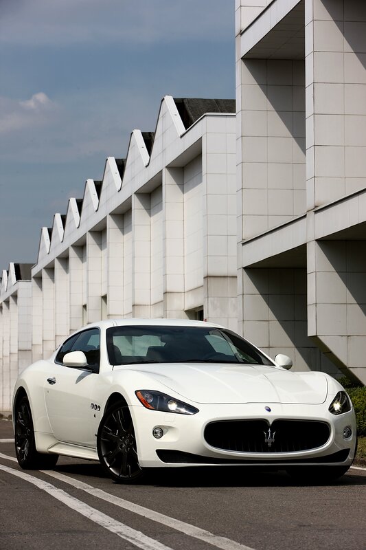 White Maserati Sports Car — Dramatic, Afternoon, Photograph, Building