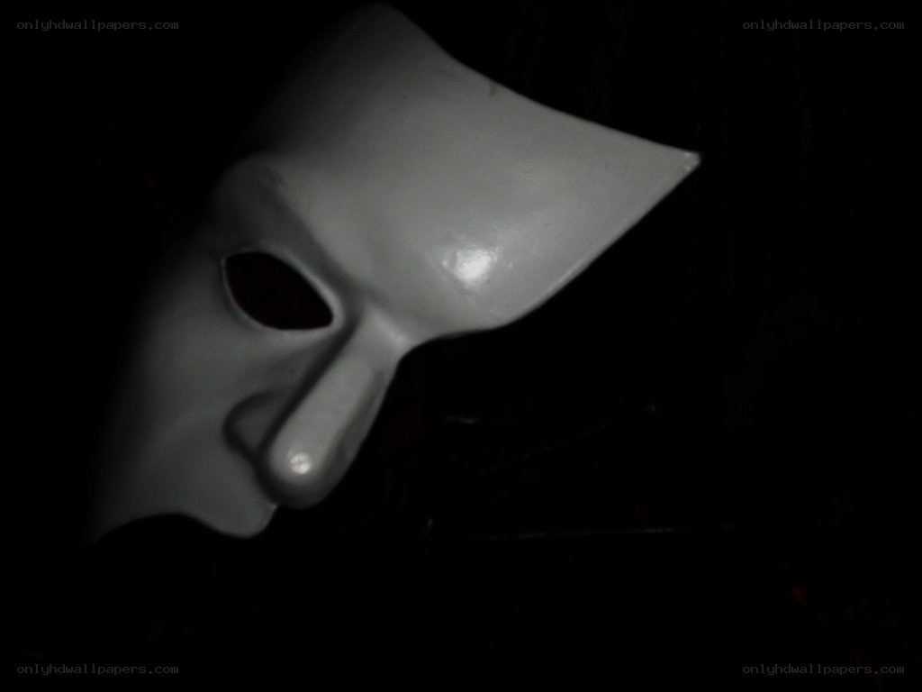white mask in darkness