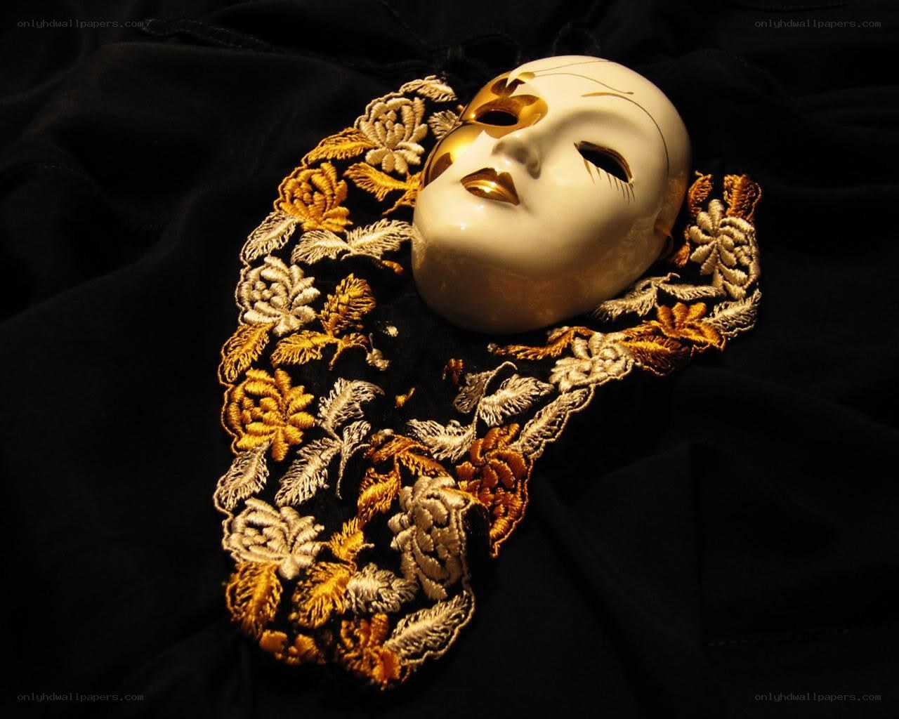 white mask with gold embroidery
