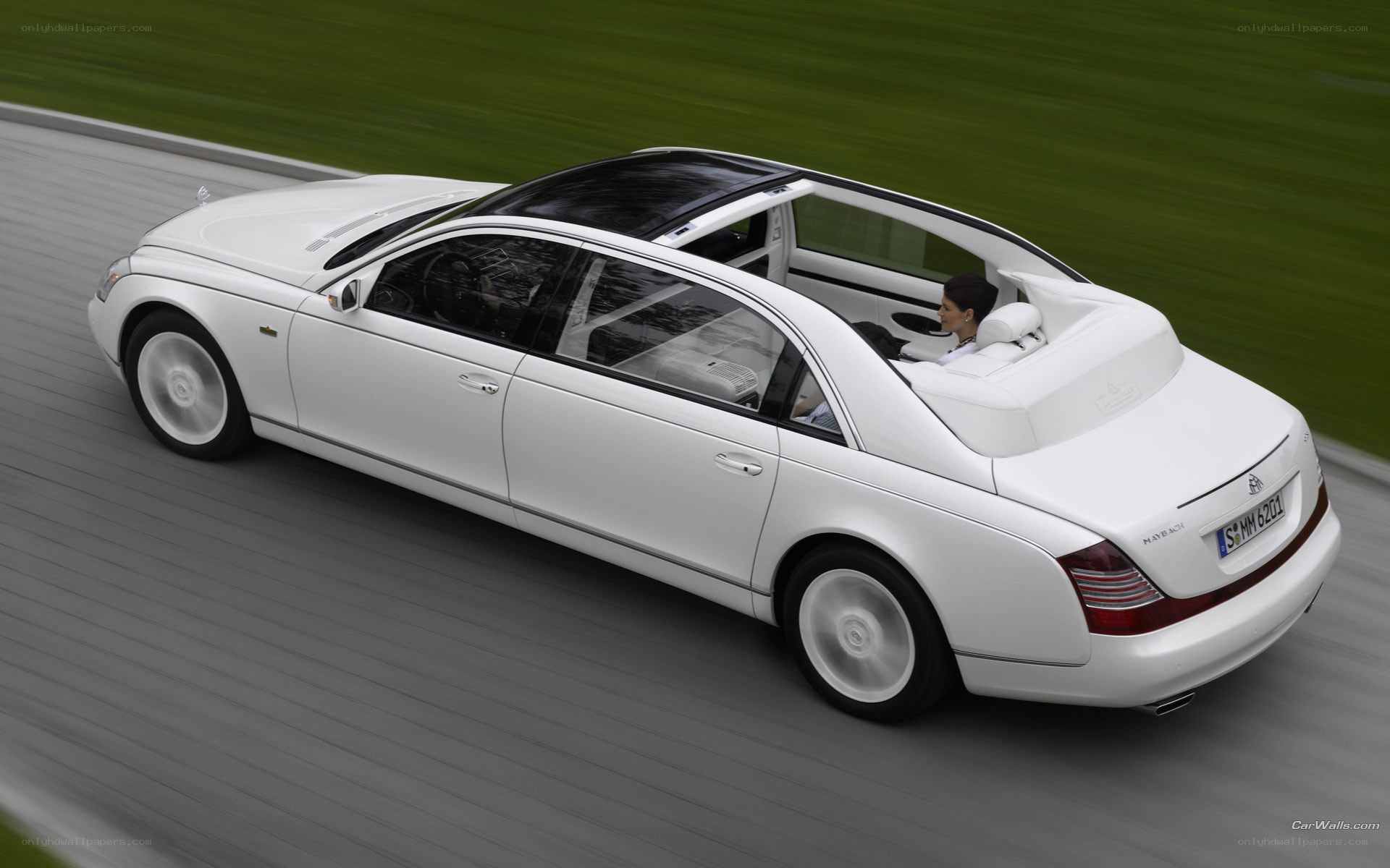 white maybach driving on road