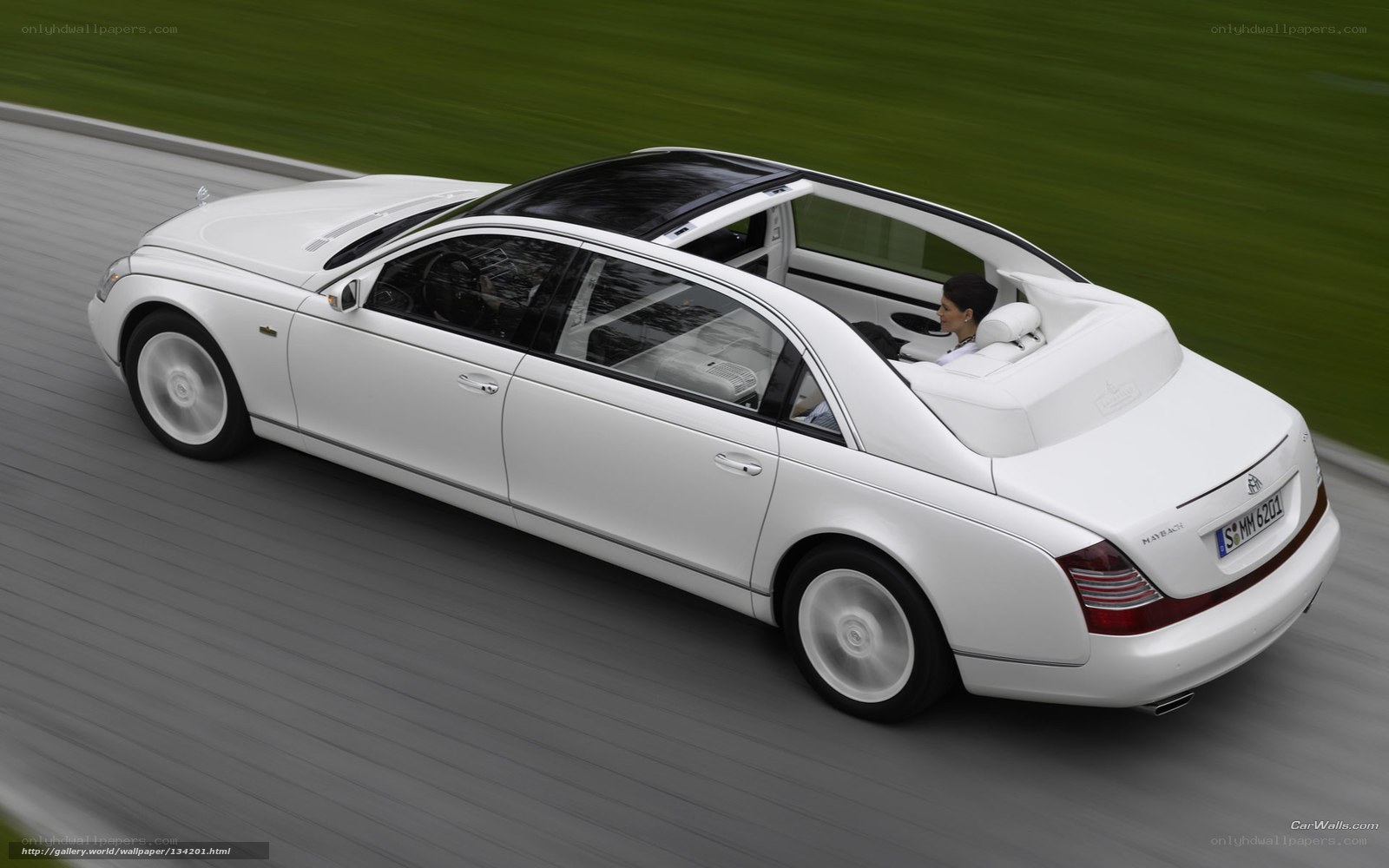 white maybach driving on road