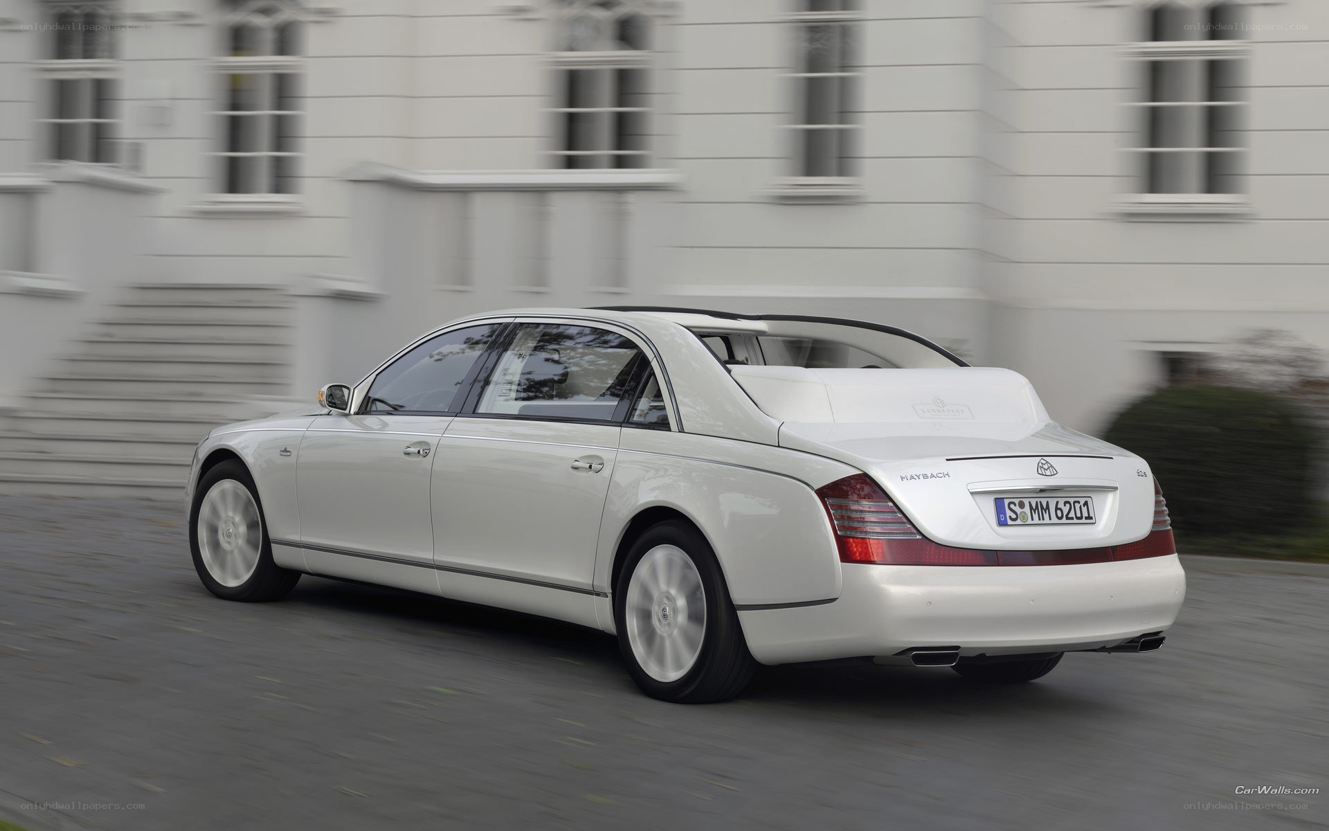 White Maybach driving on street