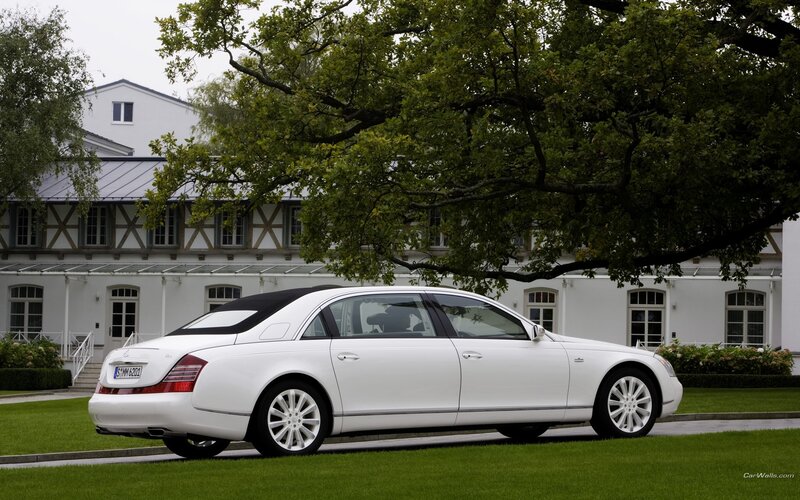white maybach parked in front of house