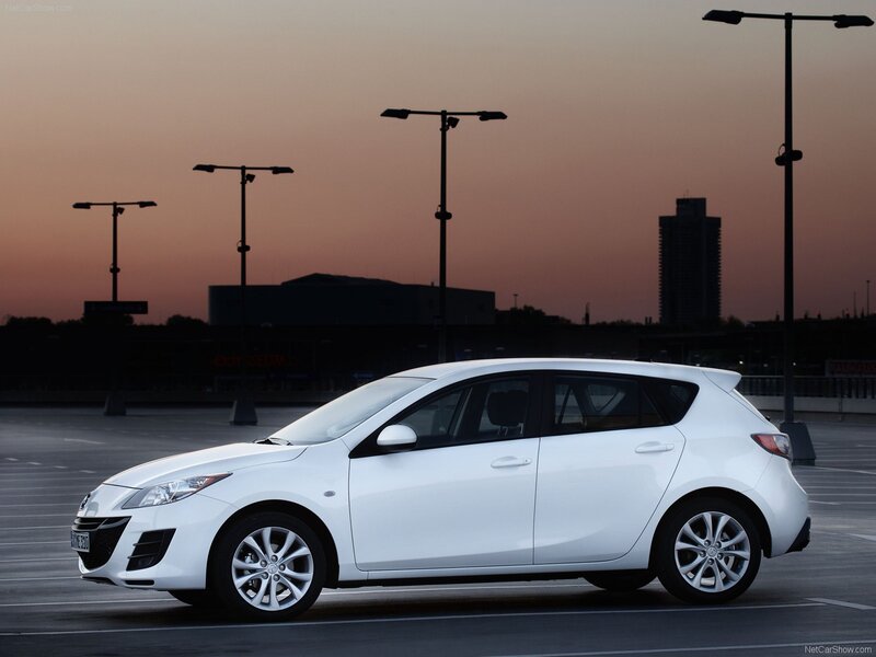 white mazda 3 hatchback