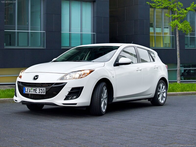 white mazda 3 hatchback