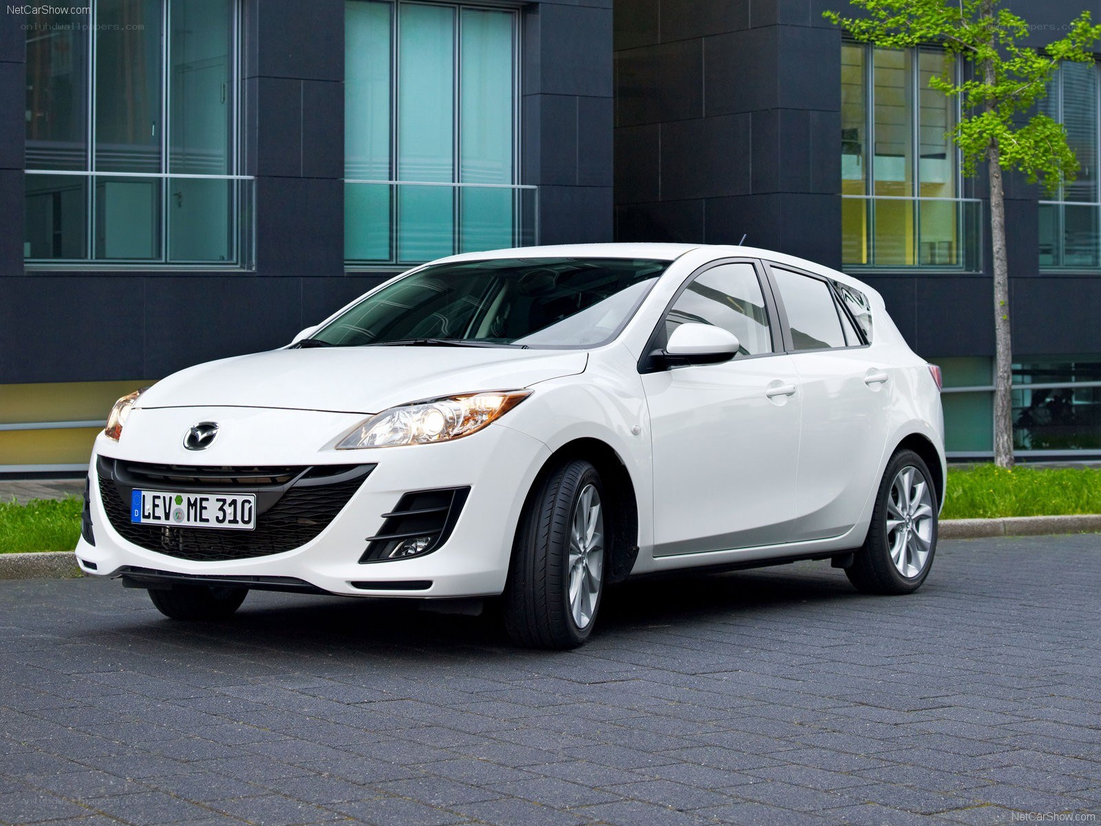 white mazda 3 hatchback