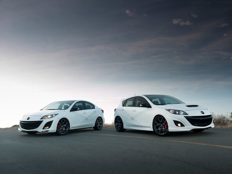 White Mazda Hatchback and Sedan — Dramatic