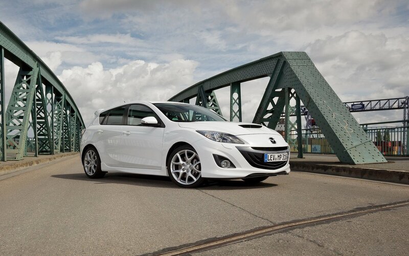 White Mazda Hatchback — Dramatic