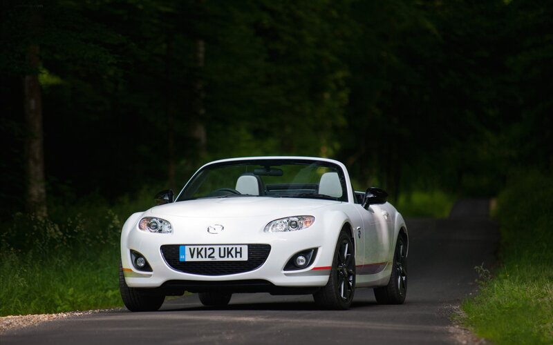 White Mazda MX-5 on a country road