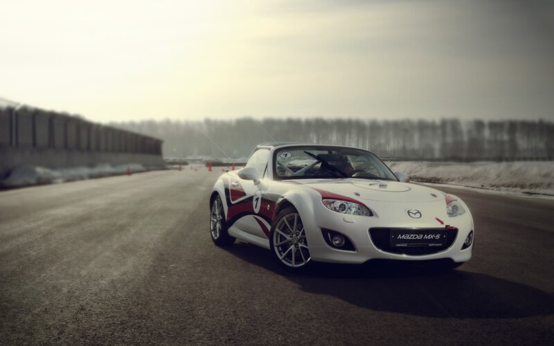 White Mazda MX-5 on a racetrack