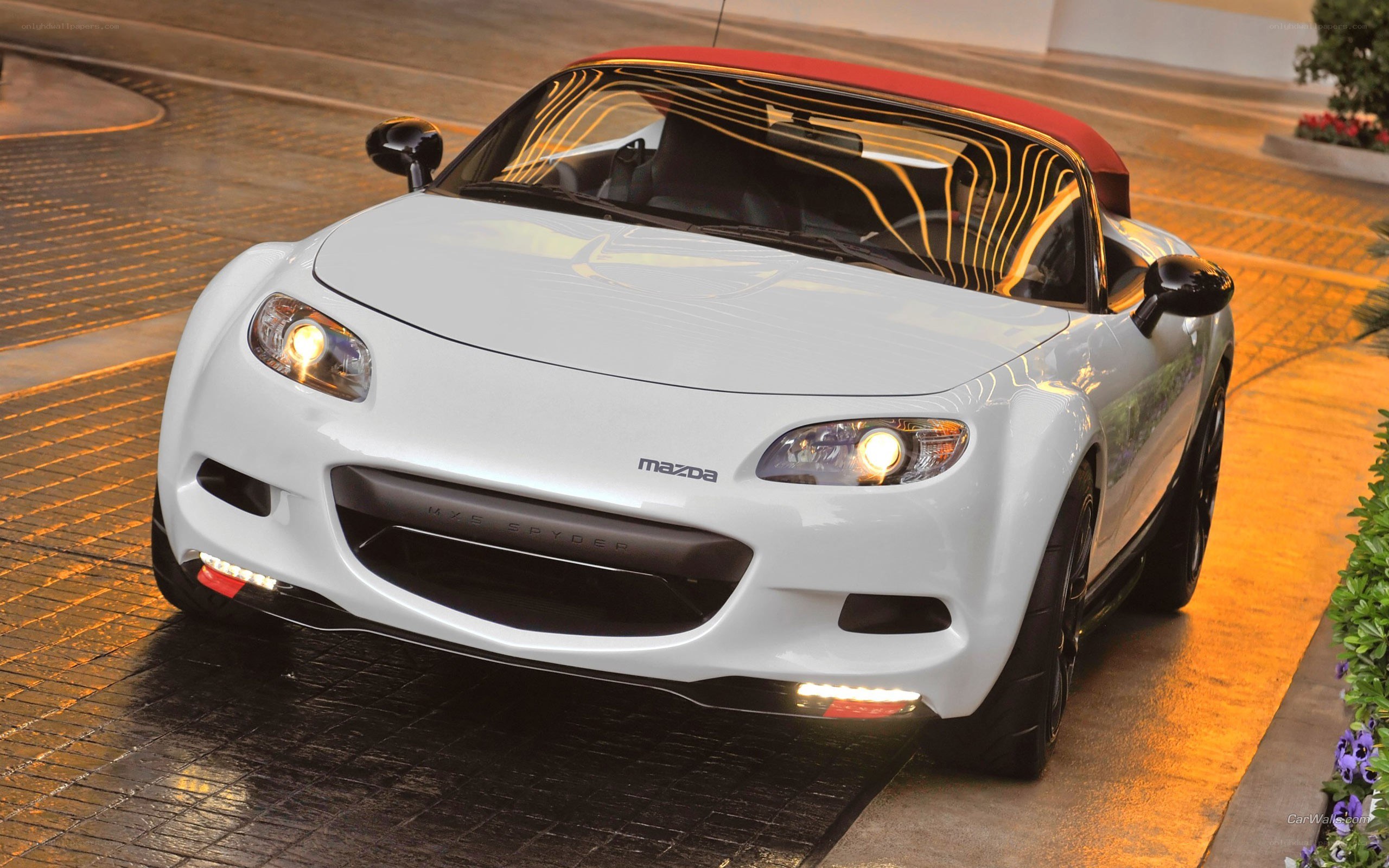 White Mazda MX-5 Spyder convertible