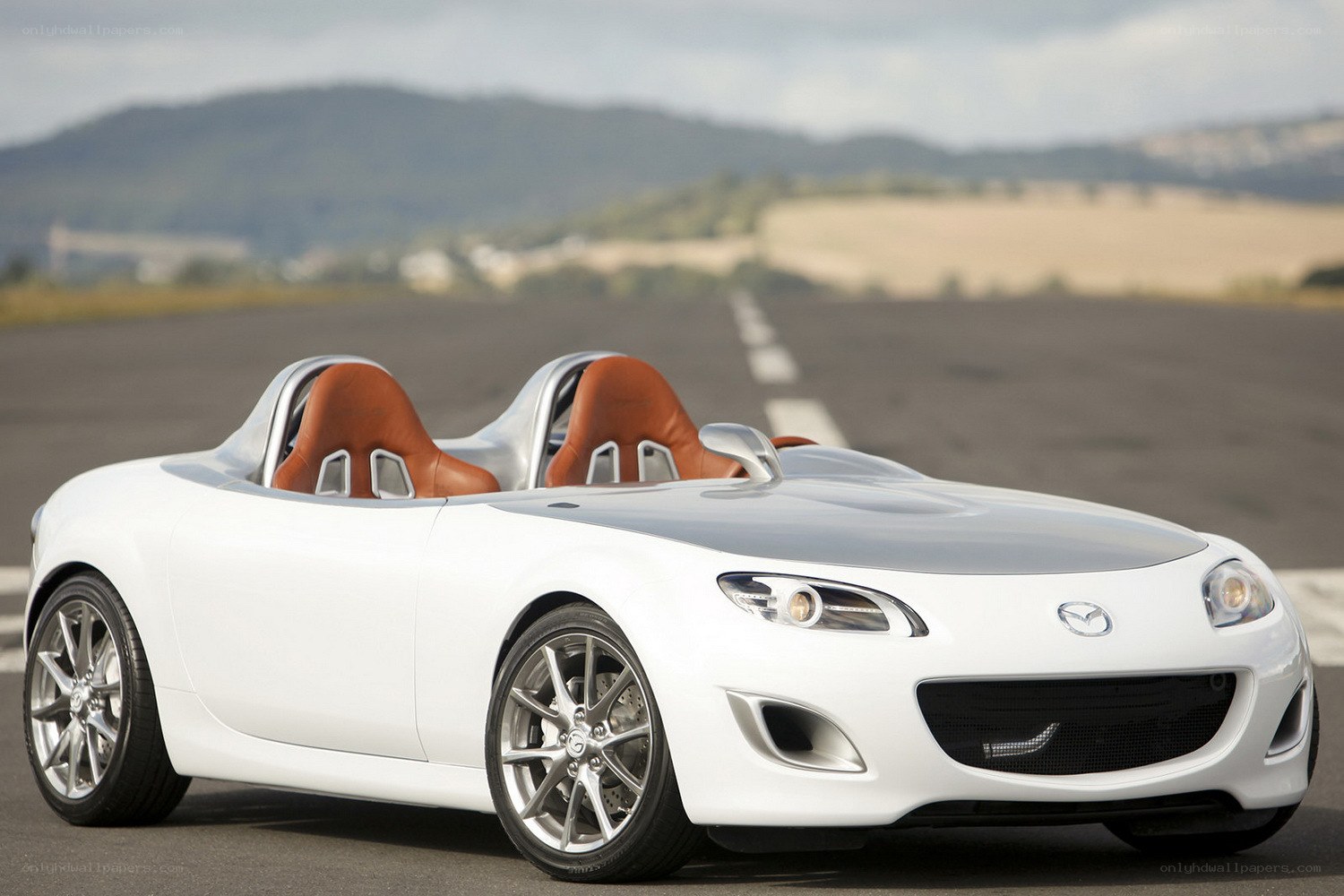 White Mazda roadster on runway
