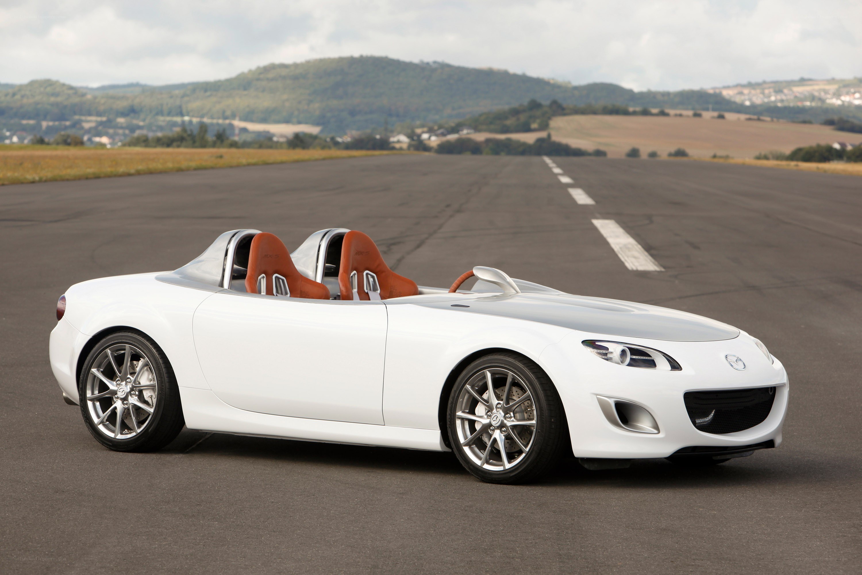 White Mazda roadster on runway