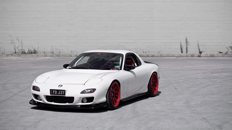 white mazda rx-7 sports car