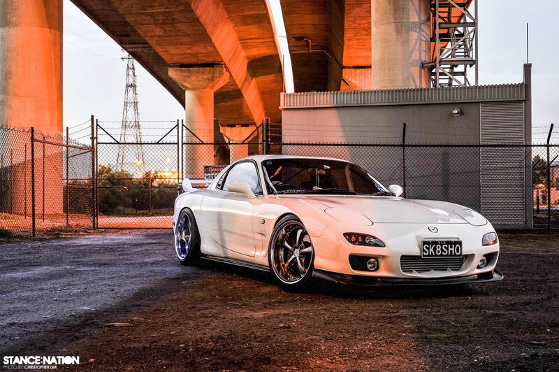White Mazda RX-7 under a bridge