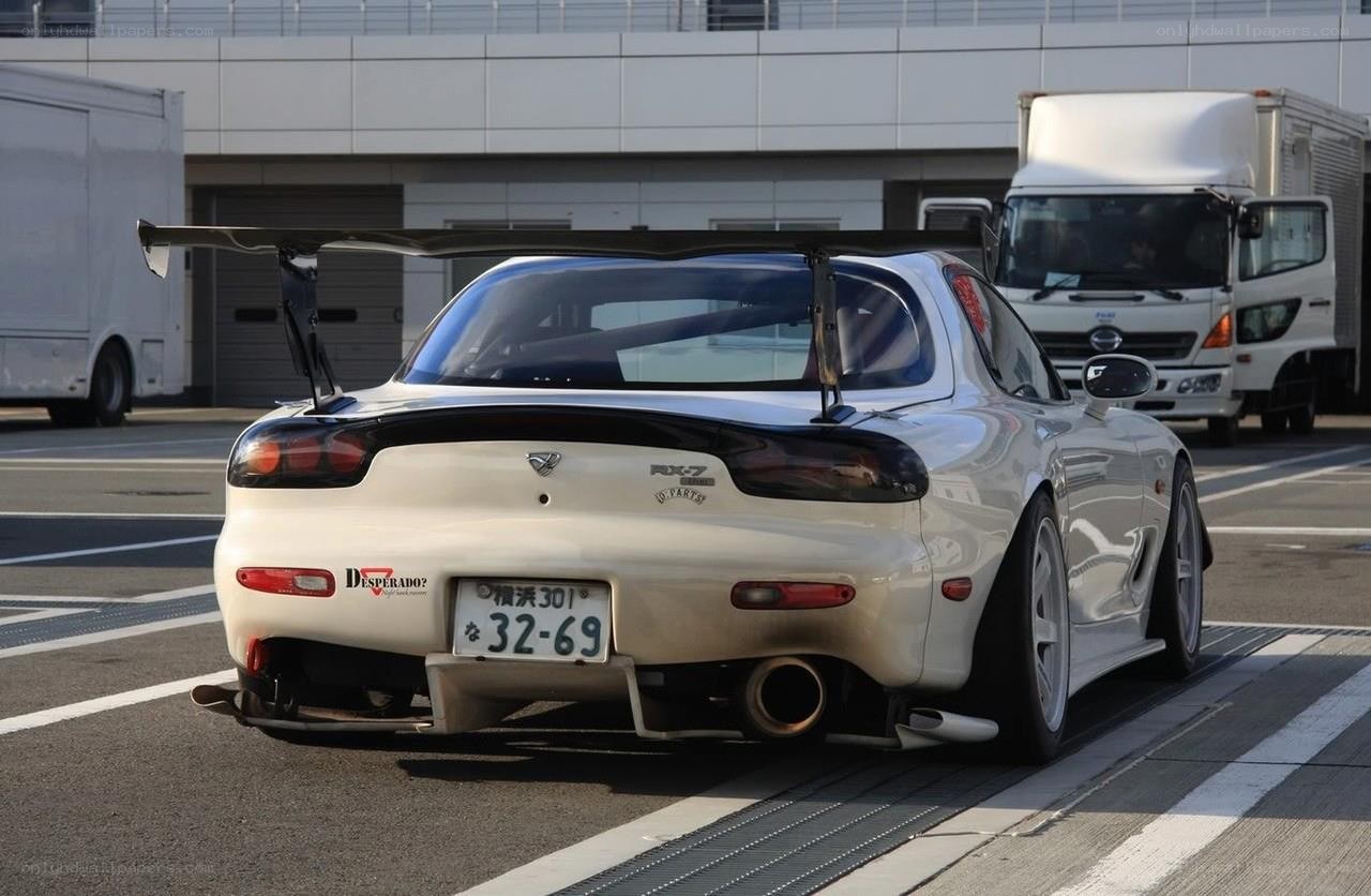 white mazda rx-7 with rear wing