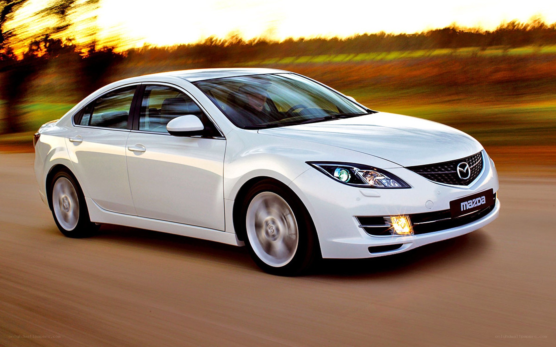 White Mazda6 in motion