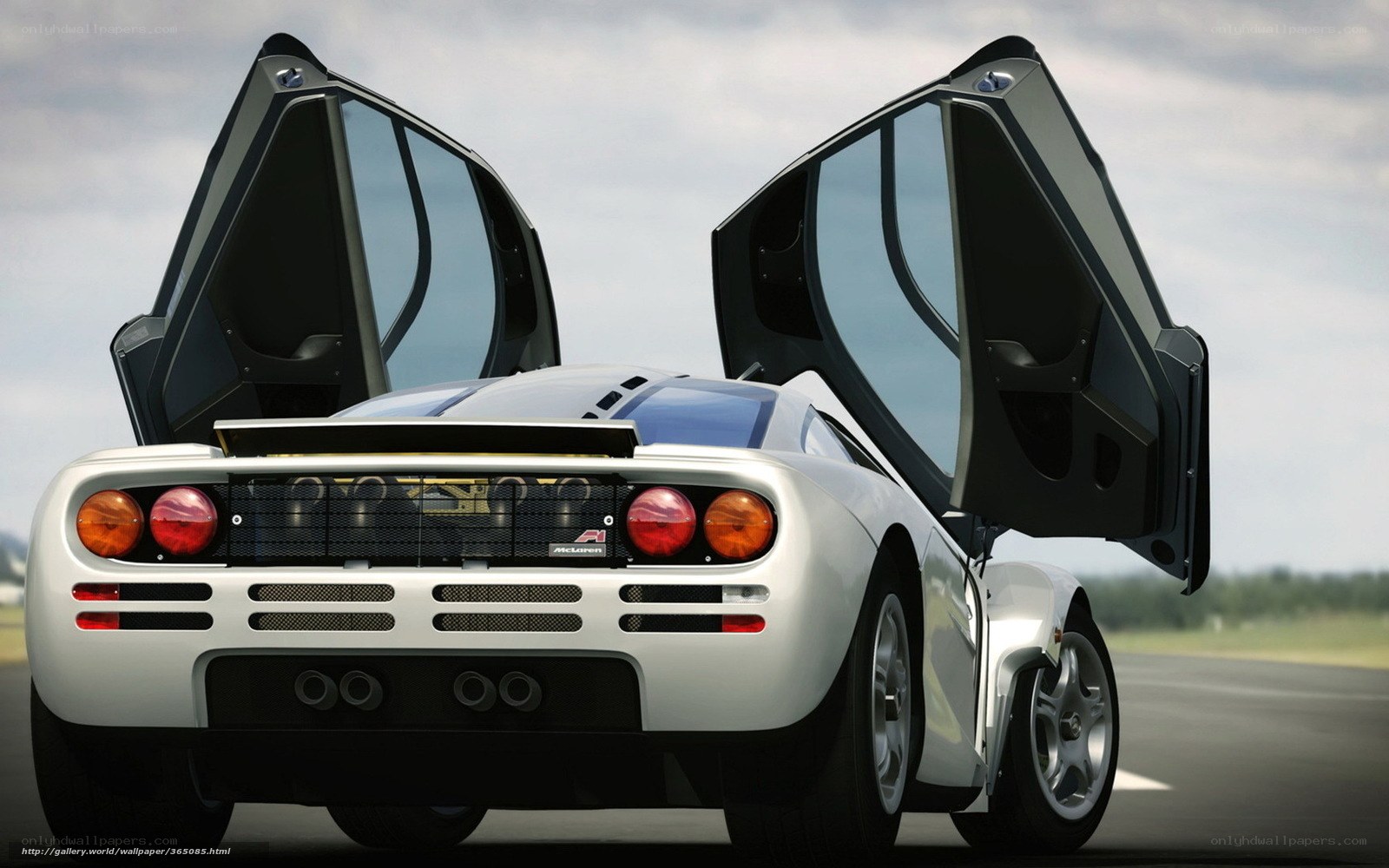 White McLaren F1 with doors open
