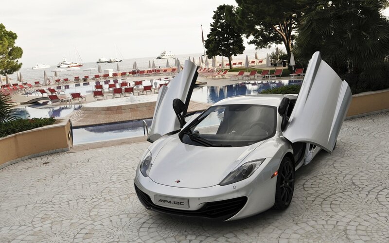 White McLaren MP4-12C by the pool