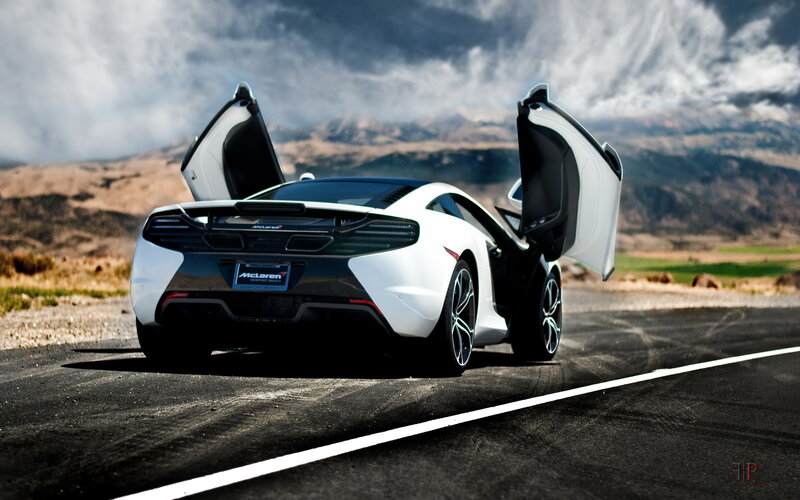 White McLaren on a desert road