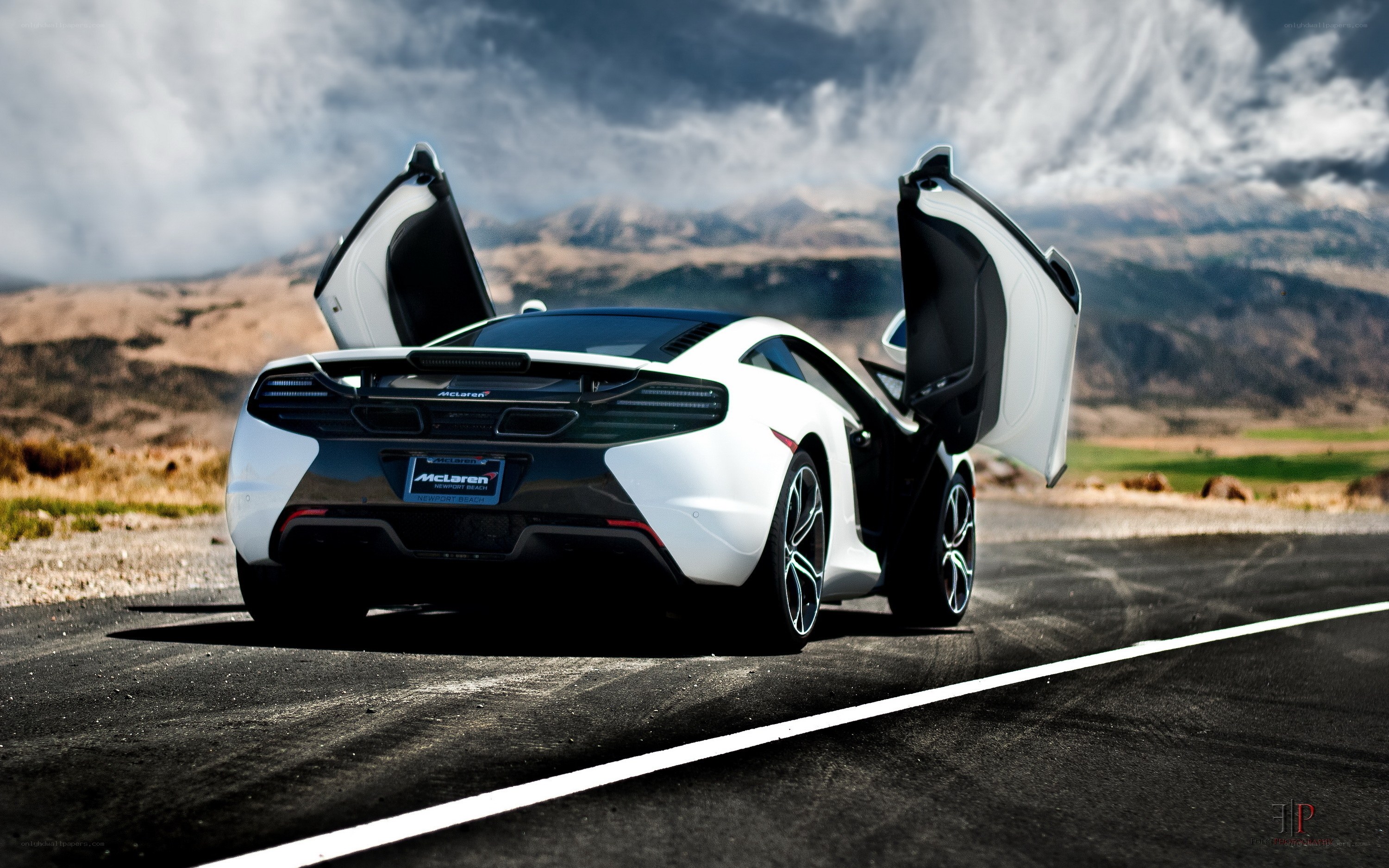 White McLaren on a desert road