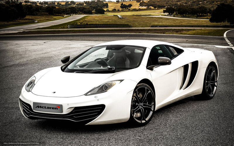 White McLaren on a racetrack