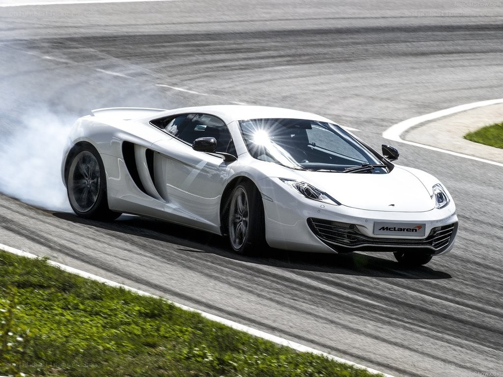 White McLaren on a racetrack