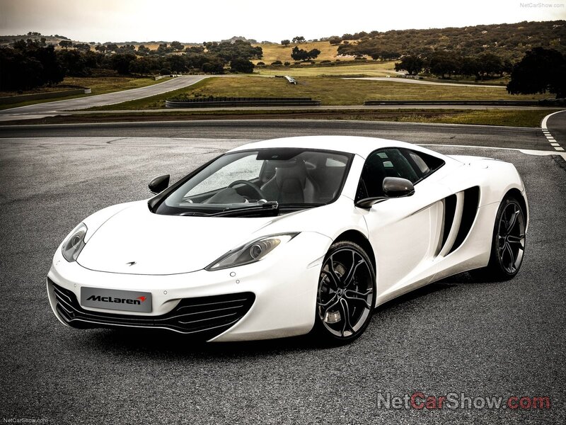 White McLaren on a racetrack