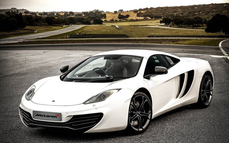 White McLaren on a racetrack