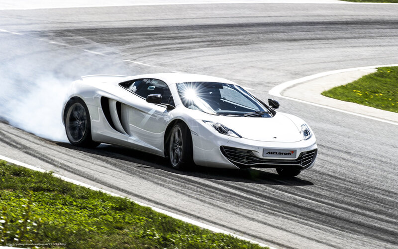 White McLaren on racetrack