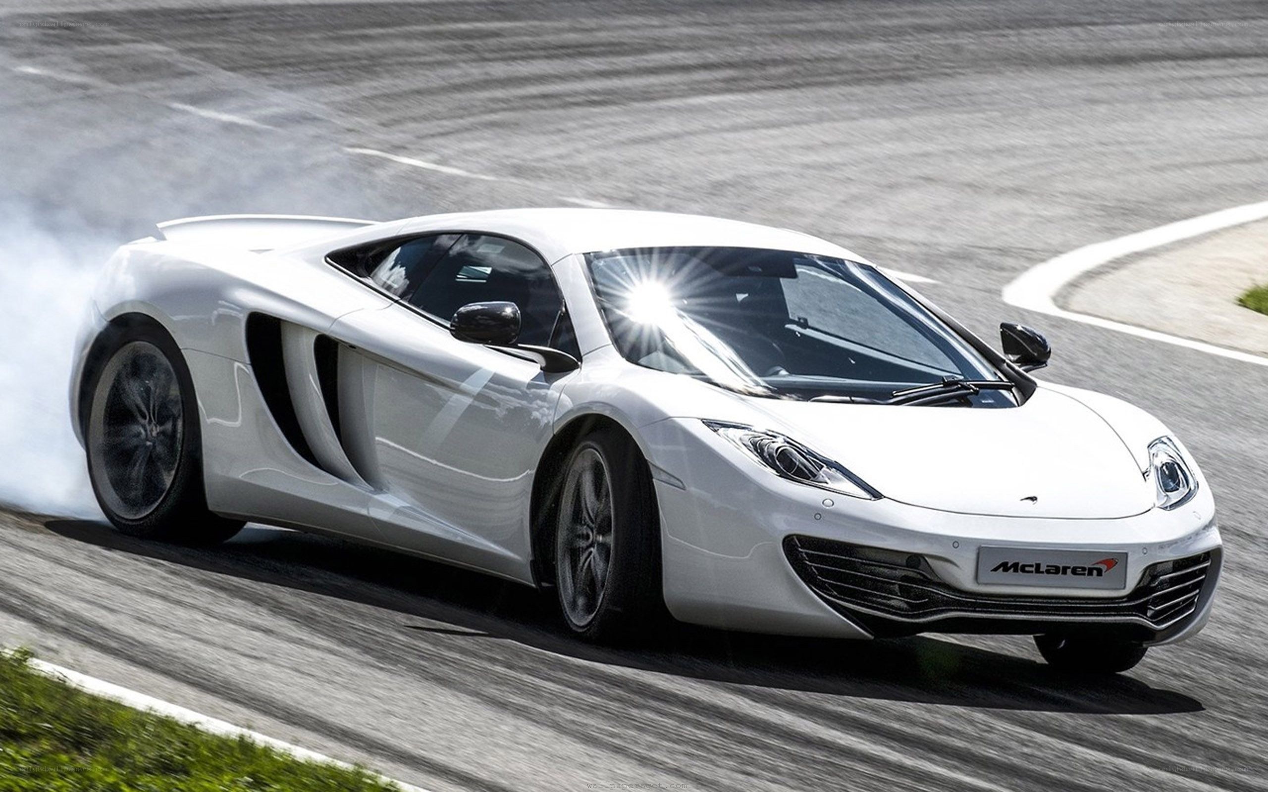 White McLaren on racetrack