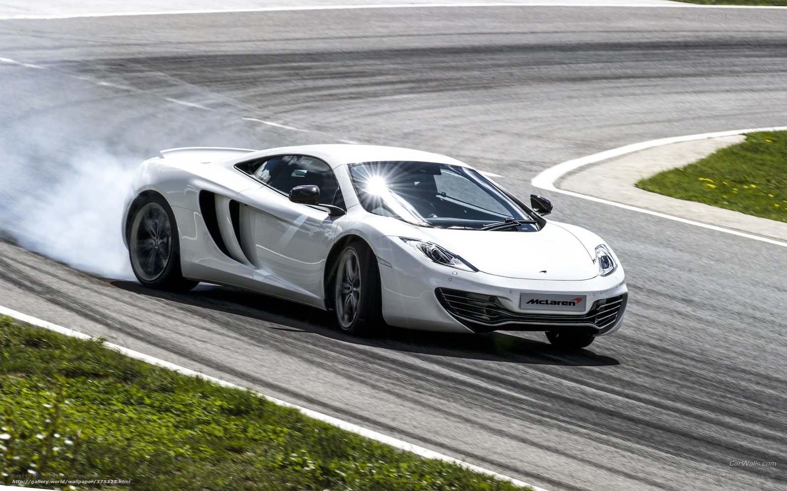 White McLaren on racetrack