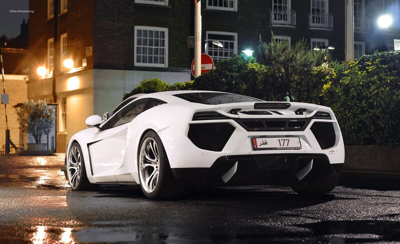 White McLaren on wet street