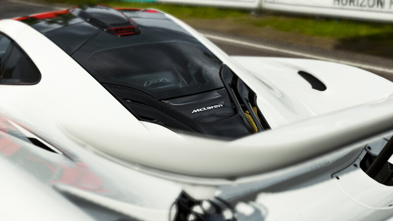 White McLaren Sports Car — Dynamic, Photograph, Race Track