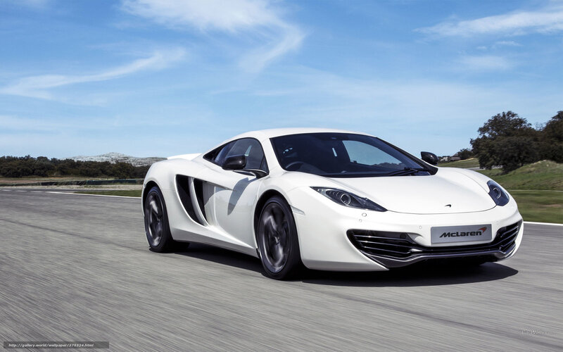 White McLaren sports car on track