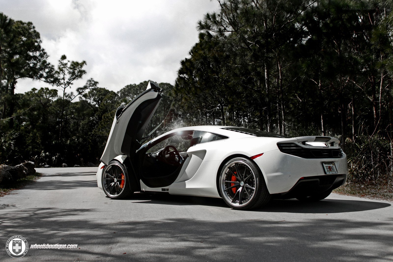 White McLaren with open door