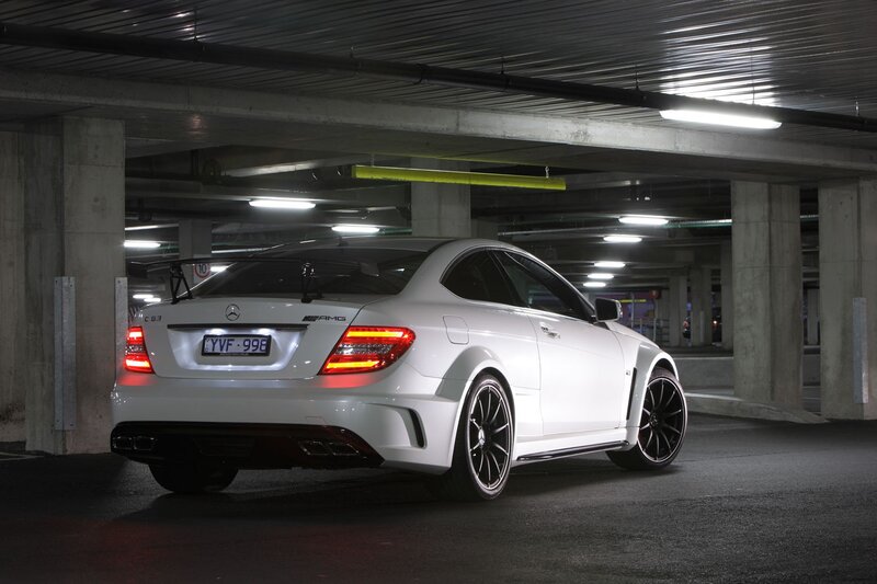 White Mercedes-AMG C63 in parking garage