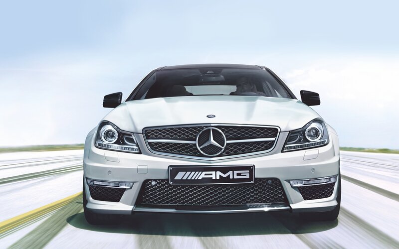 White Mercedes-AMG on a road