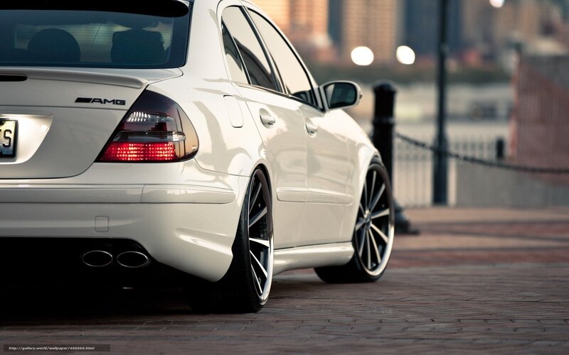white mercedes amg on city street