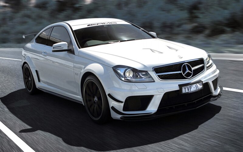 white mercedes-amg on road