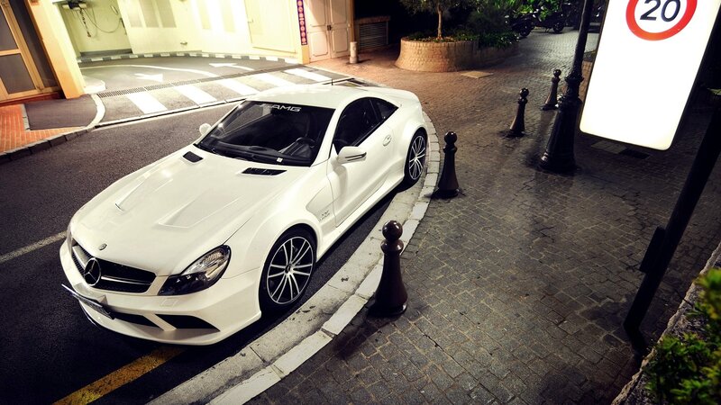 White Mercedes-AMG parked at night