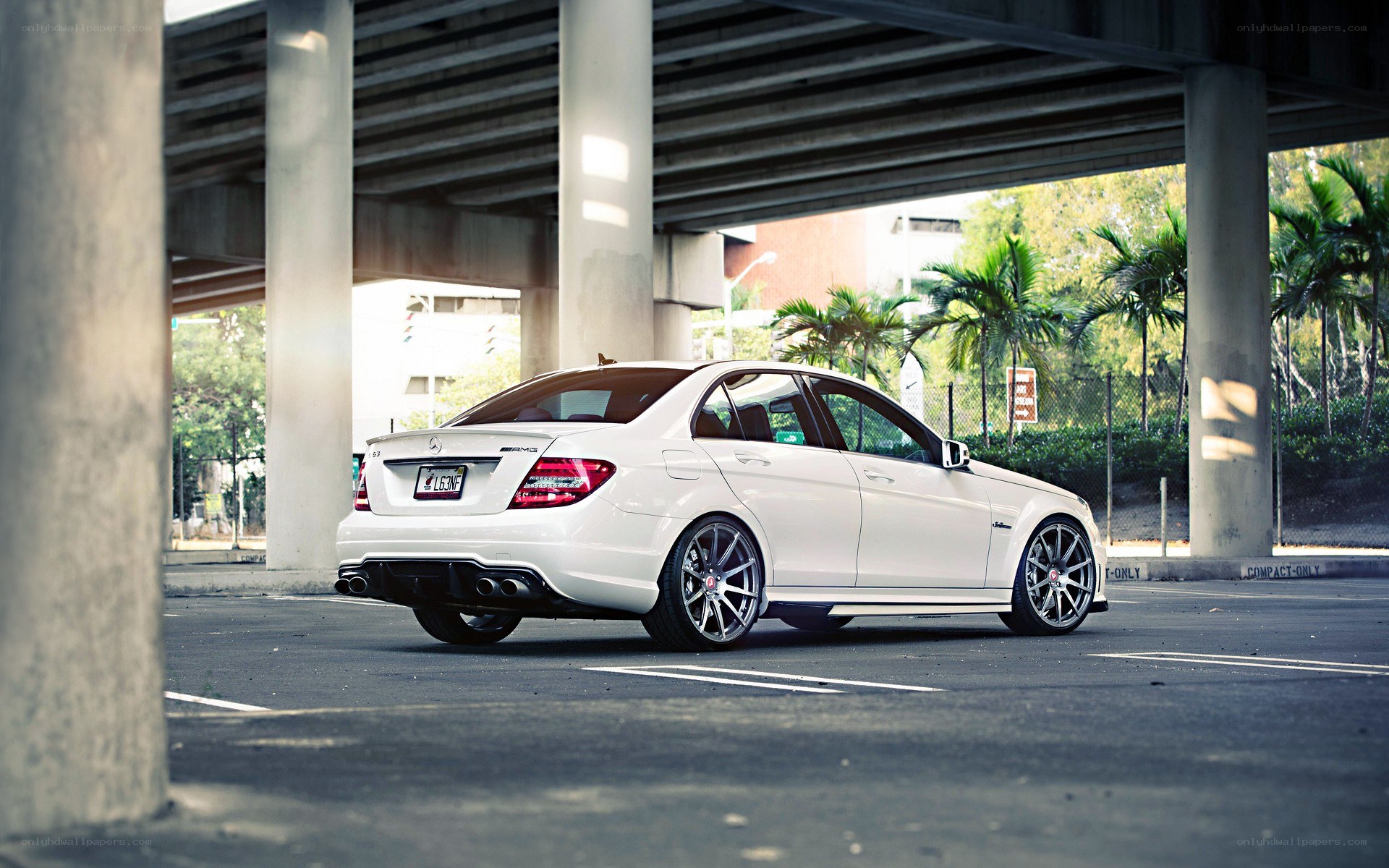 white mercedes-amg under overpass
