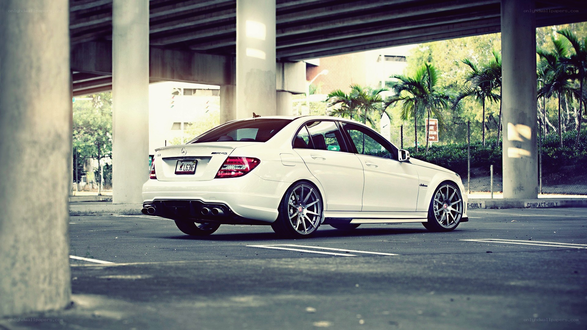 white mercedes-amg under overpass