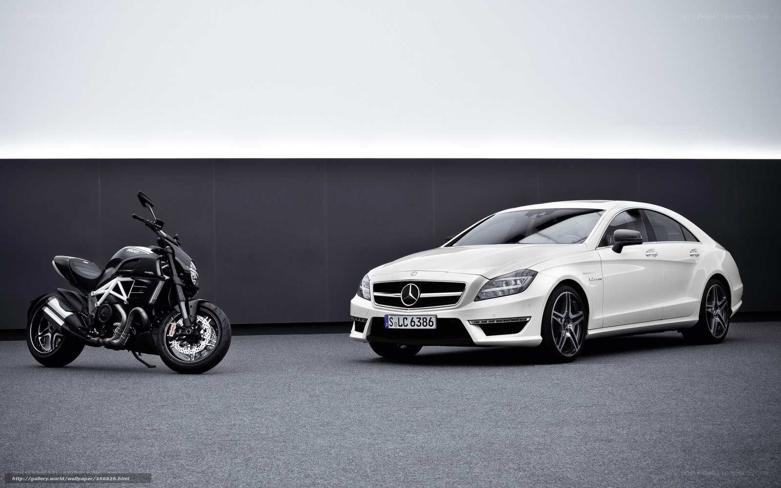 White Mercedes and Black Motorcycle
