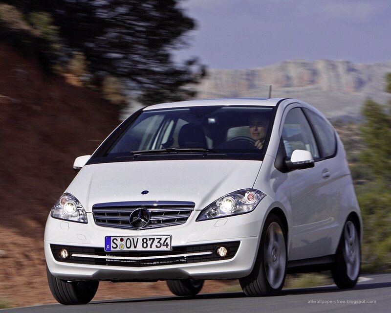 white mercedes-benz a-class driving